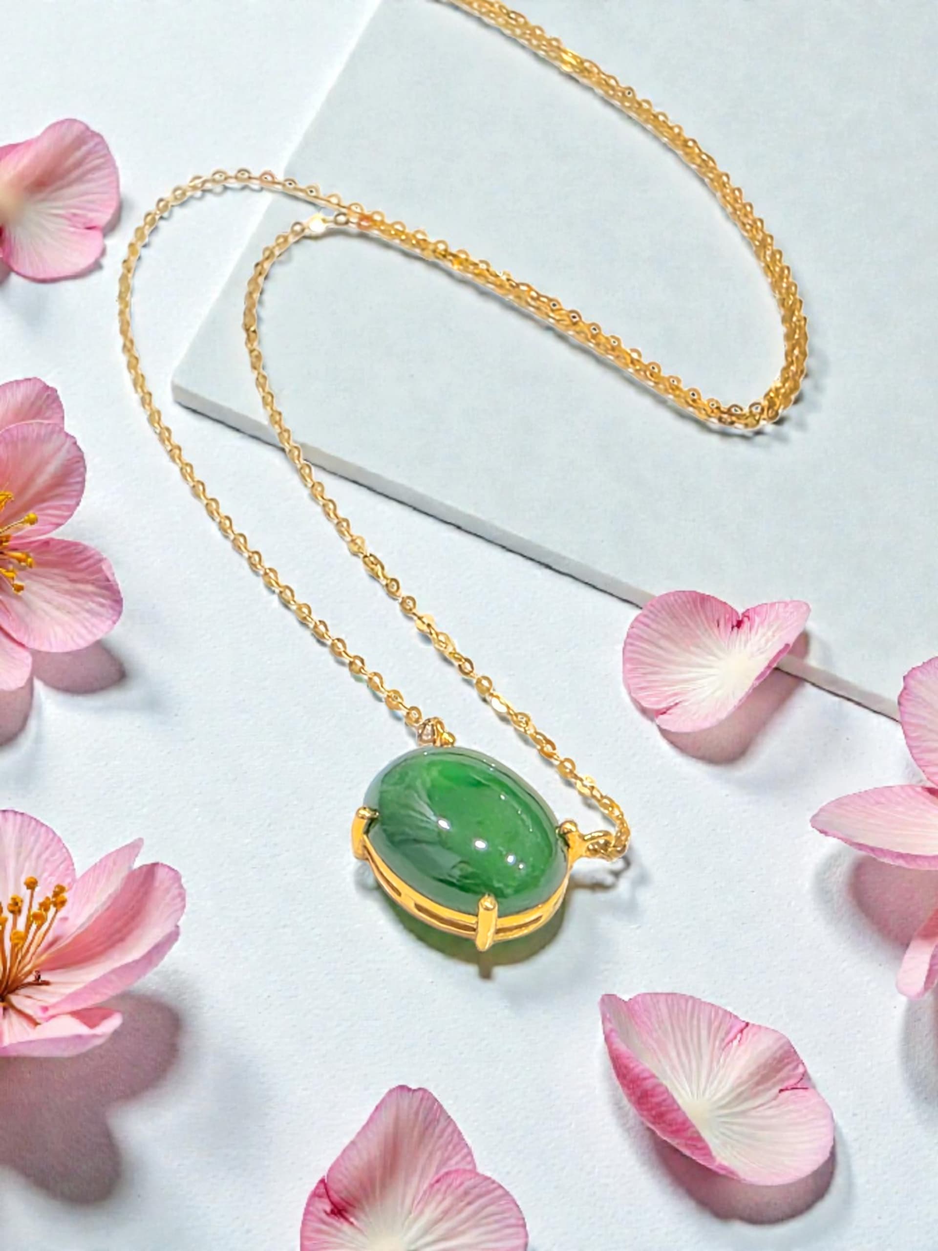 Natural jadeite pendant showing colour transition and heritage character
